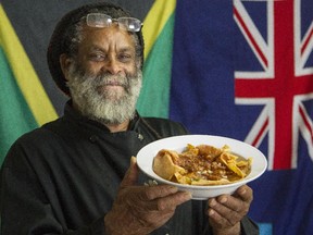 Chef Frederick White holds a bowl of Marinated Grilled Shrimp from Flavours of the Caribbean in Ottawa Wednesday April 29, 2015