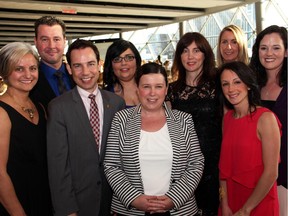 Children's Hospital of Eastern Ontario president and CEO Alex Munter, front, and CHEO chief nursing executive, Megan Wright, front and centre, with some of her CHEO nursing colleagues at the Canadian Nurses Foundation's Nightingale Gala, held at the Shaw Centre on Thursday, May 7, 2015.