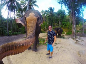 Christian LeBlanc, a 22-year-old from B.C., says he was feeding this elephant bananas when it grabbed his GoPro camera and snapped an 'elphie' or elephant selfie, in Thailand. Even getting selfies should be an experience, writes Angelina Chapin.