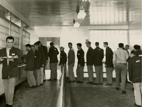 Convicts line for food trays at the Kingston Penitentiary, April 1962.