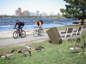Cyclists enjoy the NCC recreational pathway along the Ottawa River.
