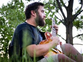 Dave Nadeau has been reunited with his Gibson guitar after it was left in an Ottawa taxi cab. Nadeau was photographed down near the Ottawa River Wednesday May 27, 2015.