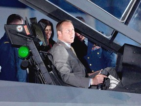 Then-minister of National Defence Peter MacKay checks out the fake cockpit of the F-35 Joint Strike Fighter in 2010. The photo op cost taxpayers $47,000.