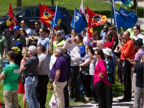 Demonstrators gather at Tunney's Pasture to protest constraints placed on the scientific community by the federal government . Representatives from the PIPSC, PSAC and CAPE spoke at the event.