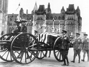 The body of Lt. Thad Johnson passes Parliament Hill in July 1927.  Johnson was killed in a crash at Ottawa airport near the road that now bears his name.