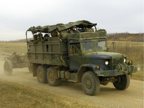 English/Anglais  AS2005-0559d  06 October 2005  Wainwright, Alberta   A gun crew from 1 Royal Canadian Horse Artillery (1 RCHA), rides in the back of an Medium Logistics Wheeled Vehicle (MLVW) towing an LG1 105 mm howitzer along Red Route in the Wainwright training area.   1 RCHA is stationed at CFB Shilo, Manitoba and is in CFB Wainwright to take part in Phoenix Ram.   Exercise Phoenix Ram, the largest combined arms brigade-training event in Canada since 1992, will be taking place at the Wainwright Training Area in Alberta.  Exercise Phoenix Ram will be a 24/7 training event that will set the precedent for Army training events across Canada in the coming years.