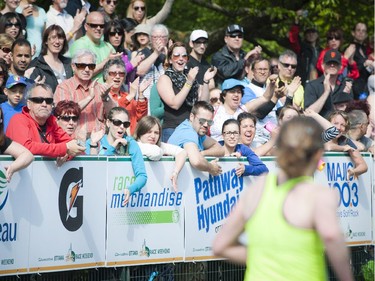 Fans and supporters cheer on the runners during the marathon at Tamarack Ottawa Race Weekend, Sunday, May 24, 2015.