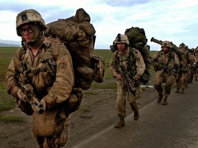 Members of the Army's 173rd Airborne Brigade on patrol after parachute landing in Hariri, Iraq Thursday, March 27, 2003.