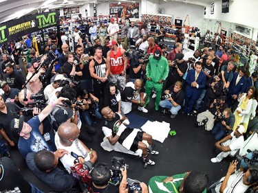 WBC/WBA welterweight champion Floyd Mayweather Jr. does situps as he works out at the Mayweather Boxing Club on April 14, 2015 in Las Vegas, Nevada. Mayweather will face WBO welterweight champion Manny Pacquiao in a unification bout on May 2, 2015 in Las Vegas.