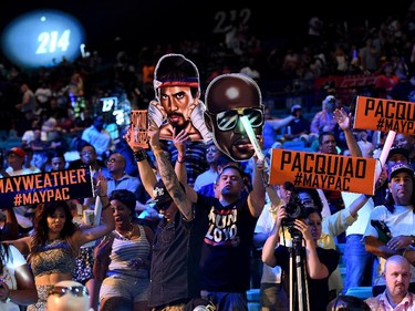 Fans cheer before the official weigh-in for Floyd Mayweather Jr. and Manny Pacquiao on May 1, 2015 at MGM Grand Garden Arena in Las Vegas, Nevada. The two boxers will face each other in a welterweight unification bout on May 2, 2015 in Las Vegas.
