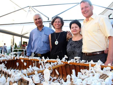 From left, Algonquin Elder Peter Decontie, Claudette Commanda, Ottawa Riverkeeper Meredith Brown and Jeff Westeinde, partner at Windmill Development, seen with Christopher Griffin's group art installation at the Ottawa Riverkeeper Gala held Wednesday, May 27, 2015.