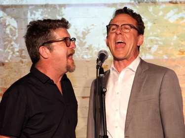 From left, Andy Maize from The Skydiggers and NDP MP Andrew Cash (Davenport) sing "You've Got a Lot of Nerve", written by Cash, at the Ottawa Riverkeeper Gala held Wednesday, May 27, 2015, at Albert Island on the Ottawa River.
