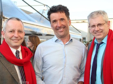 From left, Gatineau City Councillor Mike Duggan with Ottawa Centre NDP MP Paul Dewar and Timmins-James Bay NDP MP Charlie Angus, wearing their complimentary Canada Goose scarves, at the third annual Ottawa Riverkeeper Gala held at Albert Island on the Ottawa River on Wednesday, May 27, 2015.