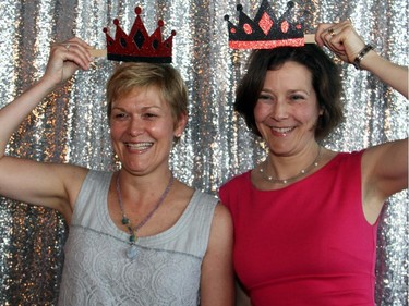 From left, Kelly Mounce and Jennifer Austin Champ ham it up at the photo booth on Thursday, May 28, 2015, at Lago during the Stepping Out! fundraiser for the Dress for Success organization that helps disadvantaged women land a job.