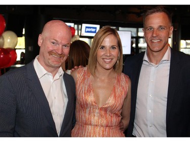 From left, Matt Hendricks from Sprott Asset Management with Dress for Success co-founder Marlene Floyd and Mike Eastwood at the Stepping Out! fundraiser held at Lago.