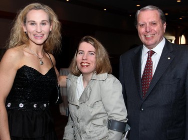 From left, Reach Canada honorary officer Chantelle Bowers with her sister, Christine Higgins, and Reach Canada honorary chair John D. Richard, retired chief justice of Canada's Federal Court of Appeal, at the St. Elias Centre on Wednesday, May 20, 2015, for the Reach Cabaret Fundraiser.