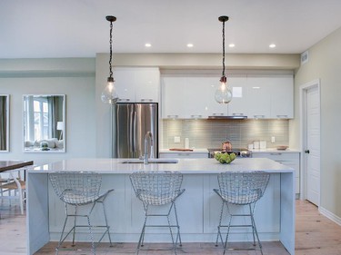 A gleaming, upgraded quartz waterfall island in the kitchen adds sparkle to the Cambridge townhome.