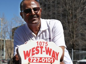 Getachew Ayele is a West-Way taxi driver who has seen his earnings plummet since Uber came to Ottawa.  (Jean Levac/ Ottawa Citizen)