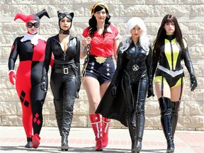 GIRL POWER (from left): Thea Nikolic (Harley Quinn), Rita Asangarani (Catwoman), Christina Zeigler (Wonder Woman), Shameea Nowsin (Storm) and Lindsay Sherman (Silk Spectre II) sashay into city hall, leaving passersby gaping.  Comiccon begins Friday at the EY Centre.