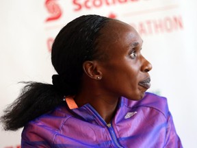 Kenyan Gladys Cherono, seen at a news conference in Ottawa, hopes to run a record time in the 10K on Saturday night.