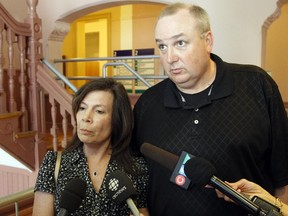 Gordon and Kathleen Stringer, whose daughter Rowan died after hitting her head playing rugby in 2013, speak to media at Ottawa City Hall after the first day of an inquest into their daughter's death ended Tuesday May 19, 2015. (Darren Brown/Ottawa Citizen)