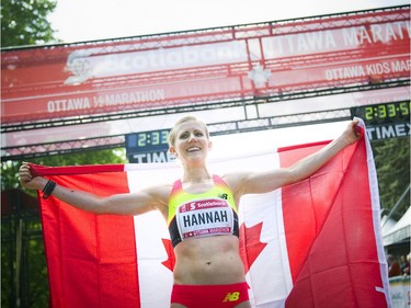 Hannah Rachel celebrates her first marathon with a first Canadian woman title at Tamarack Ottawa Race Weekend, Sunday, May 24, 2015.