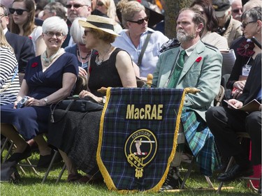 Hundreds take part in the unveiling of a new statue in honour of John McCrae in Ottawa, May 3, 2015.