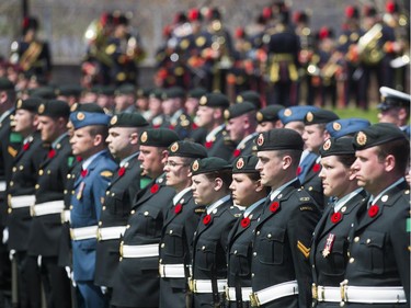 Hundreds take part in the unveiling of a new statue in honour of John McCrae in Ottawa, May 3, 2015.