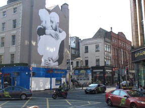 In this Thursday, April 23, 2015 photo, a gay rights mural decorates the side of a building in central Dublin, Ireland. Barely a generation ago, Ireland listed homosexual acts as a crime and made gays lead secret lives or emigrate to more liberal lands. But on Friday, May 22, 2015, in the world's first national referendum on the matter, the Irish could vote to legalize same-sex marriage.