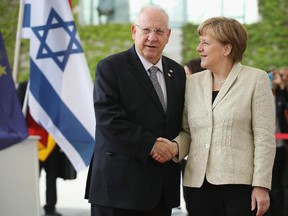 BERLIN, GERMANY - MAY 12:  German Chancellor Angela Merkel greets Israeli President Reuven Rivlin upon Rivlin's arrival at the Chancellery on the third day of his visit to Germany on May 12, 2015 in Berlin, Germany. Rivlin and his wife Nechama are in Berlin to commemorate the 50th anniversary of the resumption of diplomatic ties between Israel and what was then West Germany. The resumption of ties was a milestone in the normalization of relations between the two nations following the Holocaust.