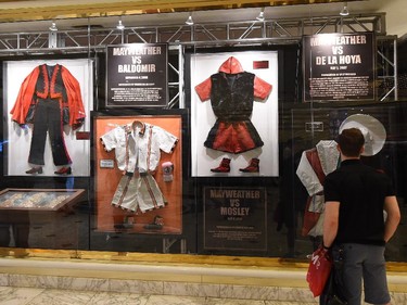 A guest looks at a display of WBC/WBA welterweight champion Floyd Mayweather Jr. memorabilia in the lobby of MGM Grand Hotel & Casino ahead of the upcoming fight between Mayweather and WBO welterweight champion Manny Pacquiao on April 29, 2015 in Las Vegas, Nevada. The two boxers will face each other in a unification bout on May 2, 2015 in Las Vegas.
