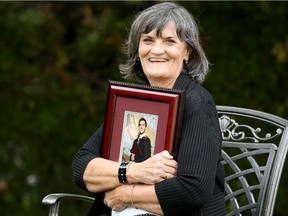 Linda McNeely, 62, holds a picture of her youngest son, Sean — a perfect match for a live liver transplant seven years ago.