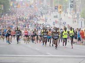 Marathoners start the race up Elgin Street during Ottawa Race Weekend Sunday May 25, 2014.