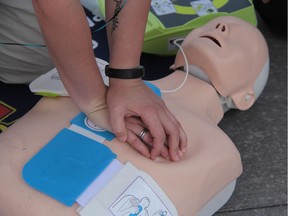 Members of the Ottawa Paramedic Service were teaching first aid and CPR to young and elderly alike in the ByWard Market on Friday.