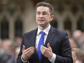 Pierre Poilievre speaks during question period in the House of Commons on Parliament Hill in Ottawa, Thursday May 1, 2014 .