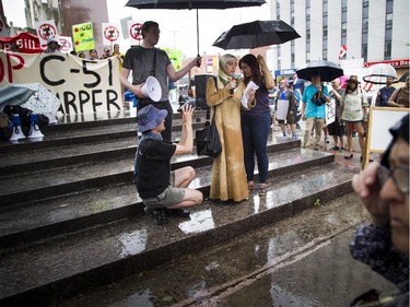 Monia Mazigh spoke to the group of protesters at the Human Rights Monument during a protest of the government's proposed anti-terrorism legislation, Bill C-51, Saturday, May 30, 2015.