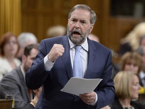 NDP Leader Tom Mulcair asks a question during Question Period in the House of Commons in Ottawa on Wednesday, May 27, 2015.