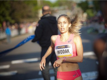 Natasha Wodak of Canada at the finish line of the 10K race at Tamarack Ottawa Race Weekend Saturday, May 23, 2015.