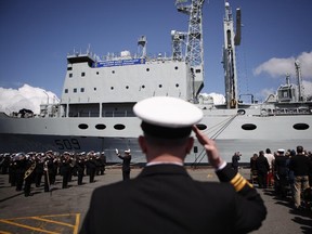 Naval officers are seen at CFB Esquimalt for HMCS Protecteur's paying-off ceremony in Esquimalt, B.C., Thursday May 14, 2015.