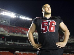 New Ottawa Redblacks offensive lineman Alex Mateas poses on the field at TD Place after he was announced as the first pick overall in the 2015 CFL Draft.