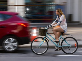 Olivia MacPherson rides along O'Connor Street on Thursday. MacPherson says she rides along every day to get to work.