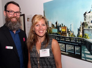 Ottawa artist and organizing committee member Danny Hussey with Ottawa artist Eryn O'Neill and her painting, which was one of 65 original artworks sold at the Ottawa Art Gallery's annual Le pARTy fundraiser on Thursday, May 21, 2015.