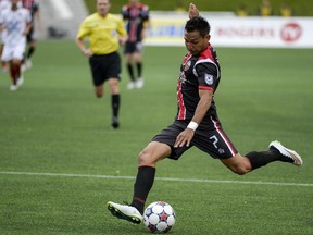 Ottawa Fury FC player Paulo Junior takes a shot against Indy Eleven at TD Place on Saturday, May 23, 2015. (James Park / Ottawa Citizen)