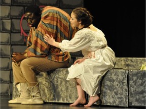 Daniel Morakinyo, performs as Quasimodo (L), and Kate Alford, performs Esmerelda (R), during Saint Francis Xavier High School's Cappies production of the The Hunchback of Notre Dame, on May 1, 2015.