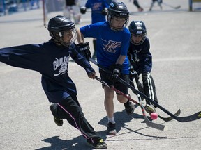 Players from Kanata Bulldogs goes up against Junior Kanata Lasers at CBC Hockey Night in Canada PlayOn! street hockey tournament at Canadian Tire Centre where around 470 teams competed on Saturday, May 23, 2015.  (James Park / Ottawa Citizen)