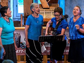 Lisa Poushinsky, second from right, pulled out of Kemptville's Dandelion Festival to protest corporate sponsorship by the TransCanada Corp energy company.