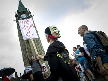 Hundreds gathered on Parliament Hill, protesting the government's proposed anti-terrorism legislation, Bill C-51, Saturday, May 30, 2015.