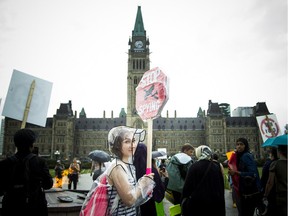 Hundreds gathered on Parliament Hill, protesting the government's proposed anti-terrorism legislation, Bill C-51, Saturday, May 30, 2015.