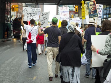 Hundreds made their way through the Market, disrupting traffic, protesting the government's proposed anti-terrorism legislation, Bill C-51, Saturday, May 30, 2015.