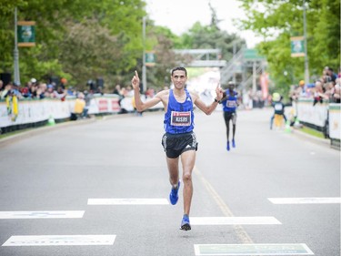 Rachid Kisri pushes to finish the marathon at Tamarack Ottawa Race Weekend, Sunday, May 24, 2015.